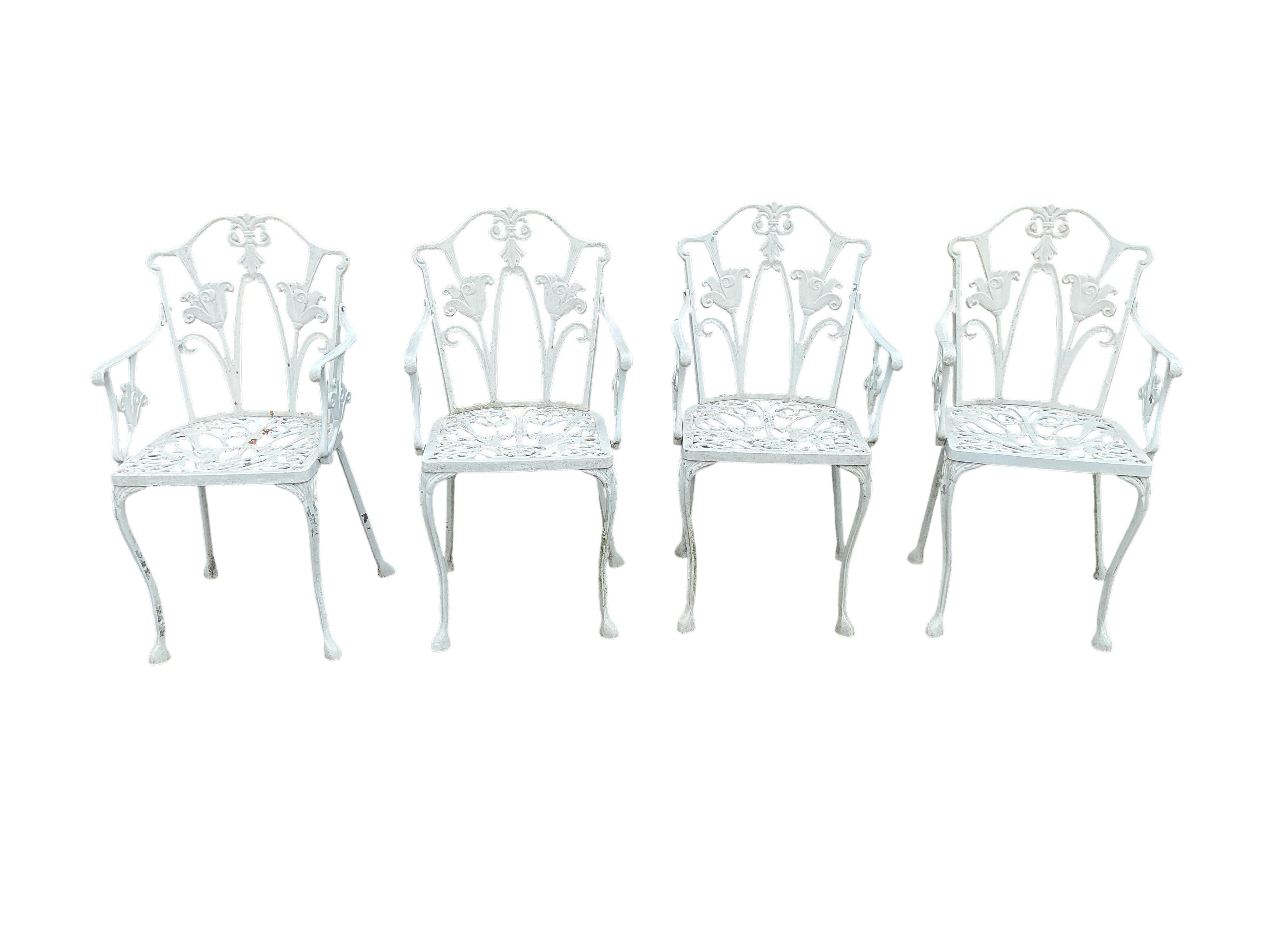 A Victorian style circular aluminium garden table, diameter 89cm, height 70cm and six chairs